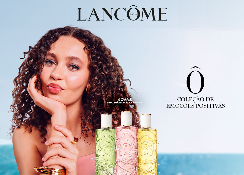 Modelo com cabelo encaracolado ao lado das 3 novidades Ô de Lancôme em verde, rosa e amarelo.